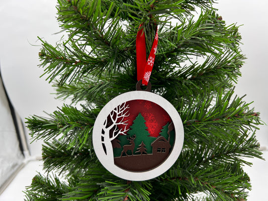 Christmas Ornament - 4 layer Deer and Cabin Winter scene with green trees and red snowflake back